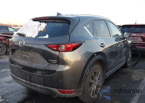 2021 Mazda Cx-5 Signature z USA, uszkodzony, nr VIN JM3KFBEY6M0358024